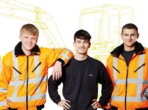 3 junge Menschen in Arbeitsjacken