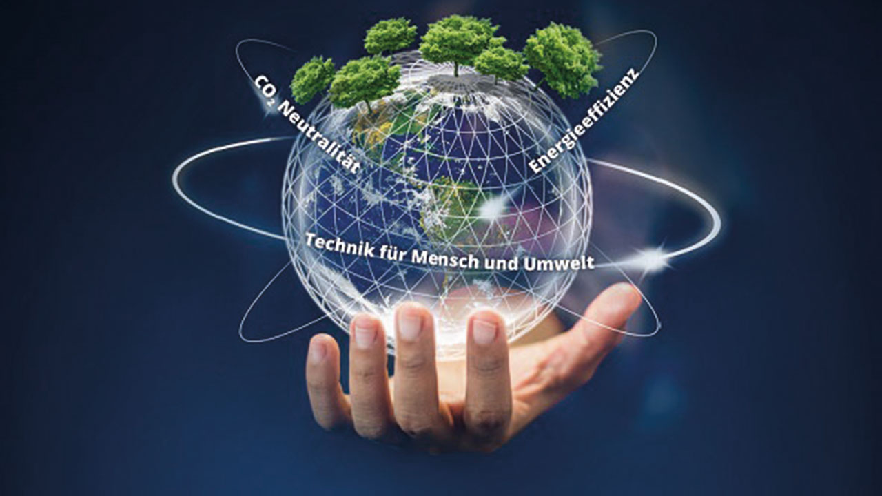 Hand mit einer Kugel mit Bäumen bepflanzt, darum kreisen die Begriffe: CO2-Neuträlität - Energieeffizienz - Technik für Mensch und Umwelt